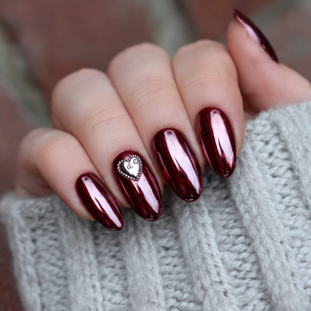 cherry chrome with tiny heart detail nails