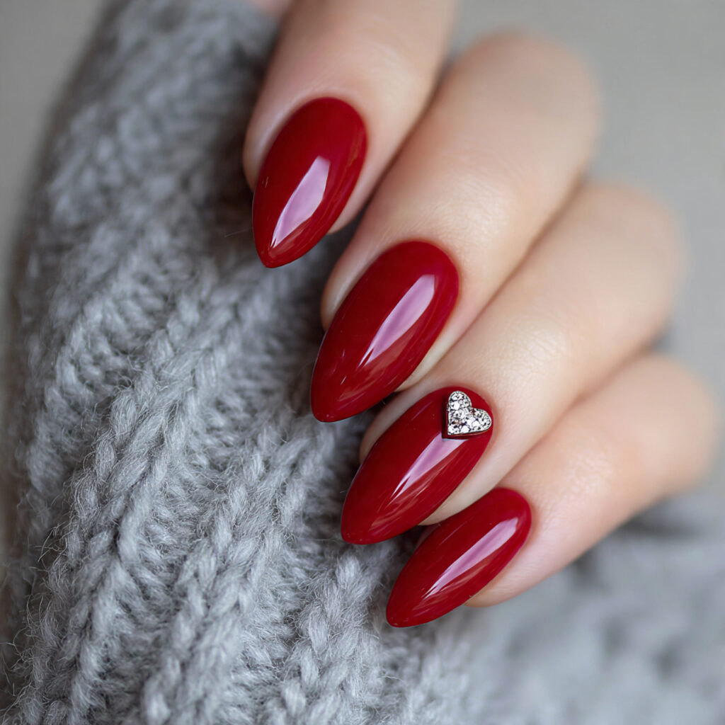 cherry red almond with heart accent nails