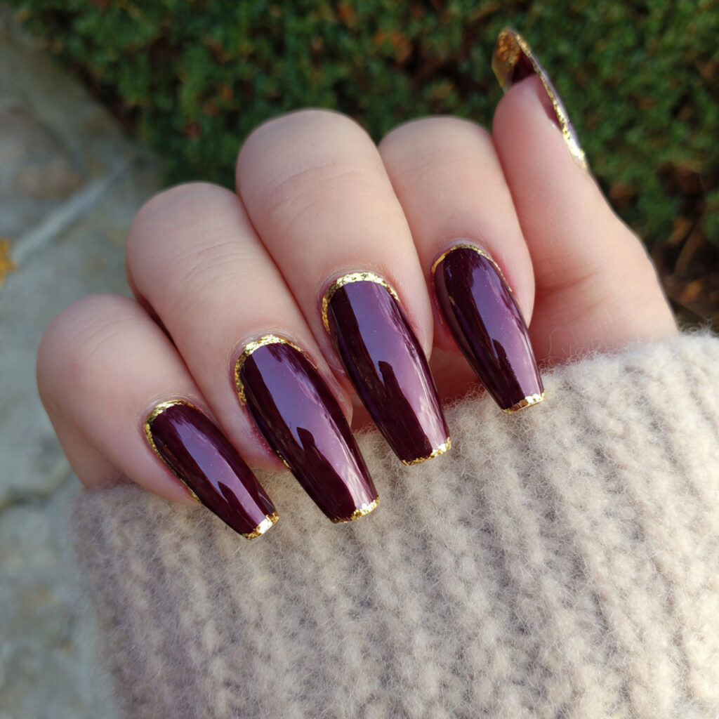 deep wine chrome with gold cuticle detail nails