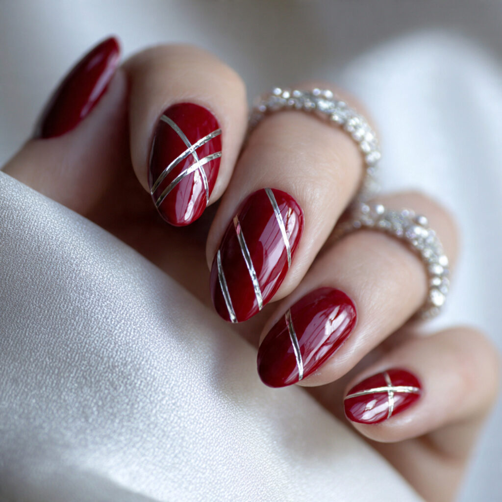 glossy cherry red with silver chrome lines nails
