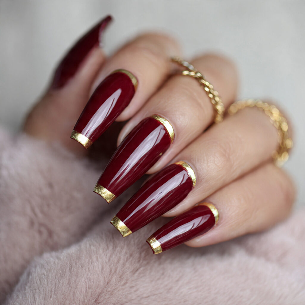 long crimson coffin with gold tips nails