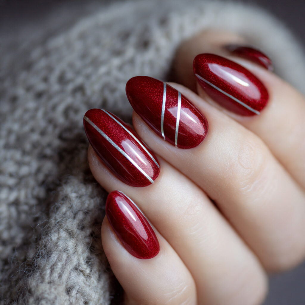 red almond with silver line art nails