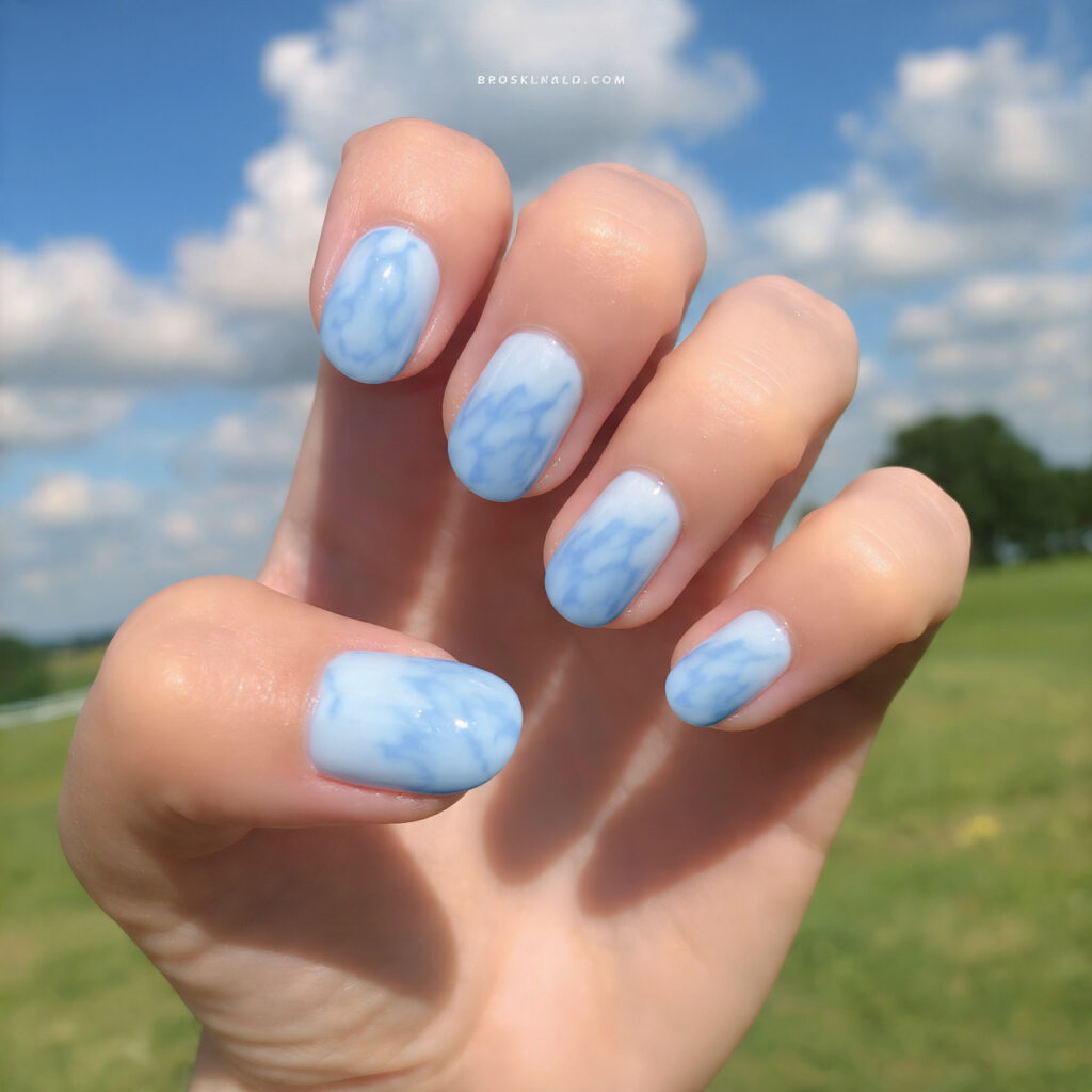attractive baby blue cloudy day gloss nails with s