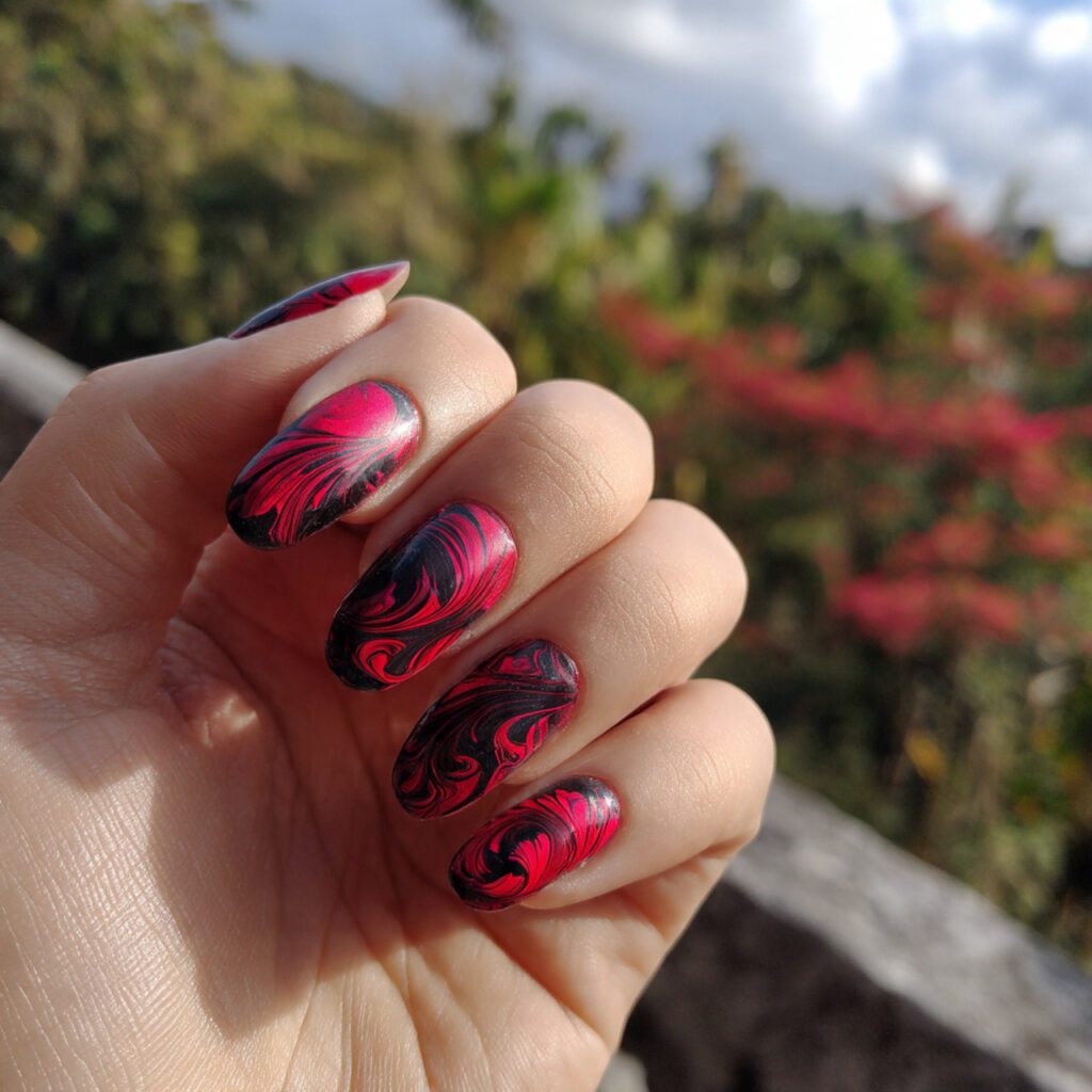 attractive base with red swirl art nails with outd 1