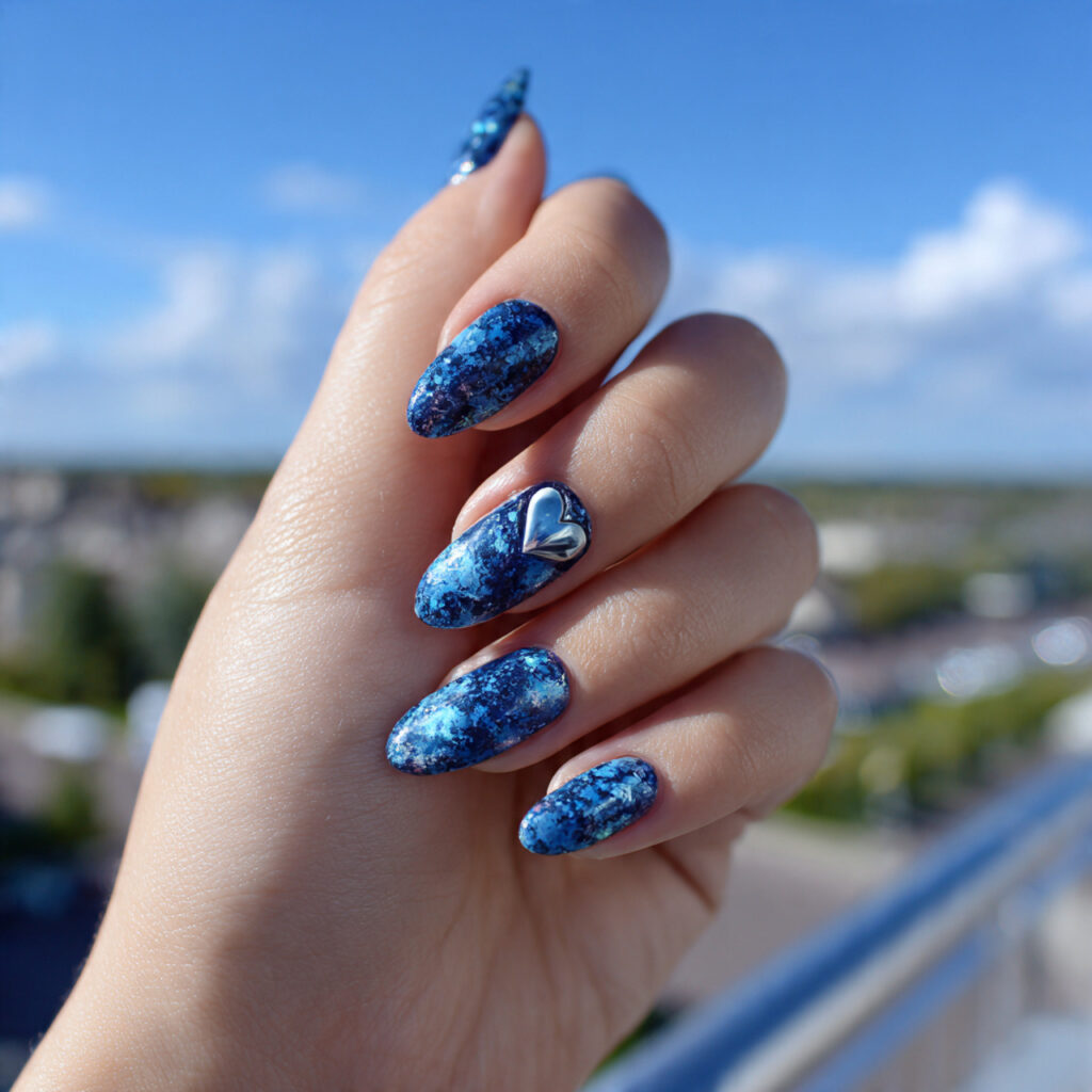 attractive blue heart detail nails with outdoor ba