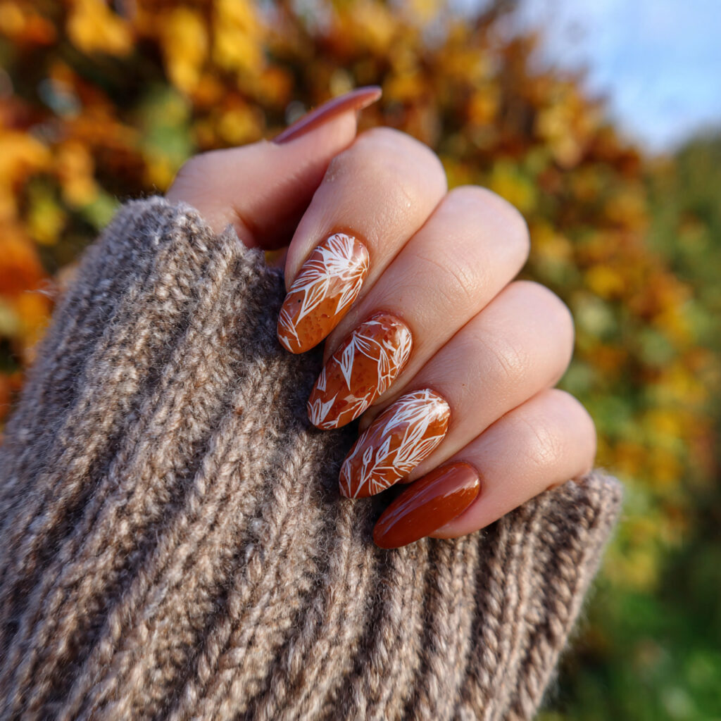 attractive caramel latte oval nails with outdoor f