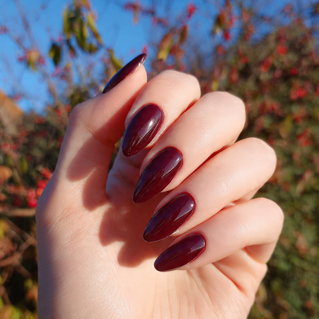 attractive cherry gloss almond length nails with o