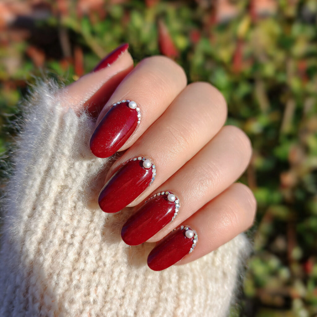 attractive cherry red with mini pearl accents nail 2