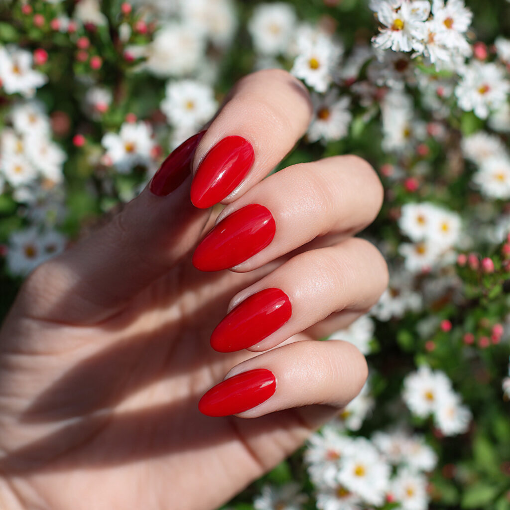 attractive classic scarlet red acrylic almond nail