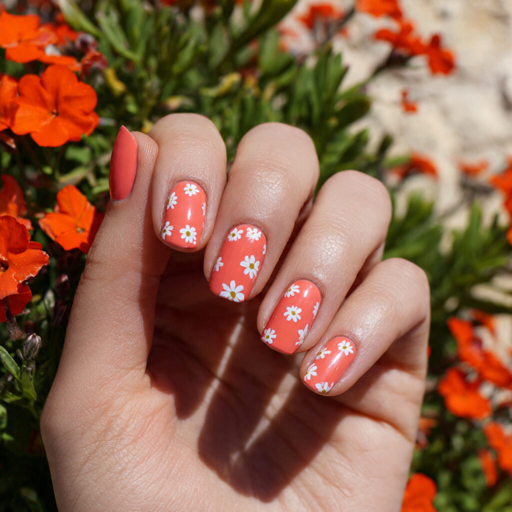 attractive coral base with mini white florals nail
