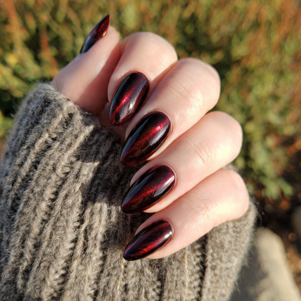 attractive garnet cat eye acrylic drama nails with