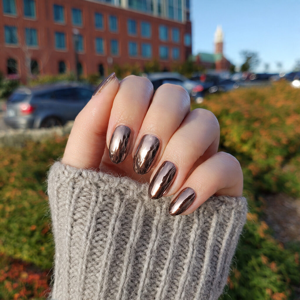 attractive glazed mocha chrome nails with outdoor