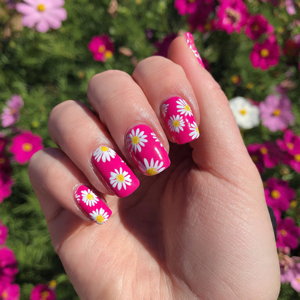 attractive hot pink daisy nails with outdoor summe
