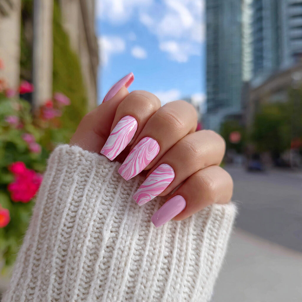 attractive light pink swirl nails with outdoor sum