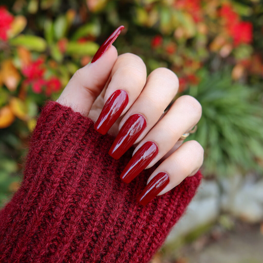 attractive long chili red acrylic drama nails with