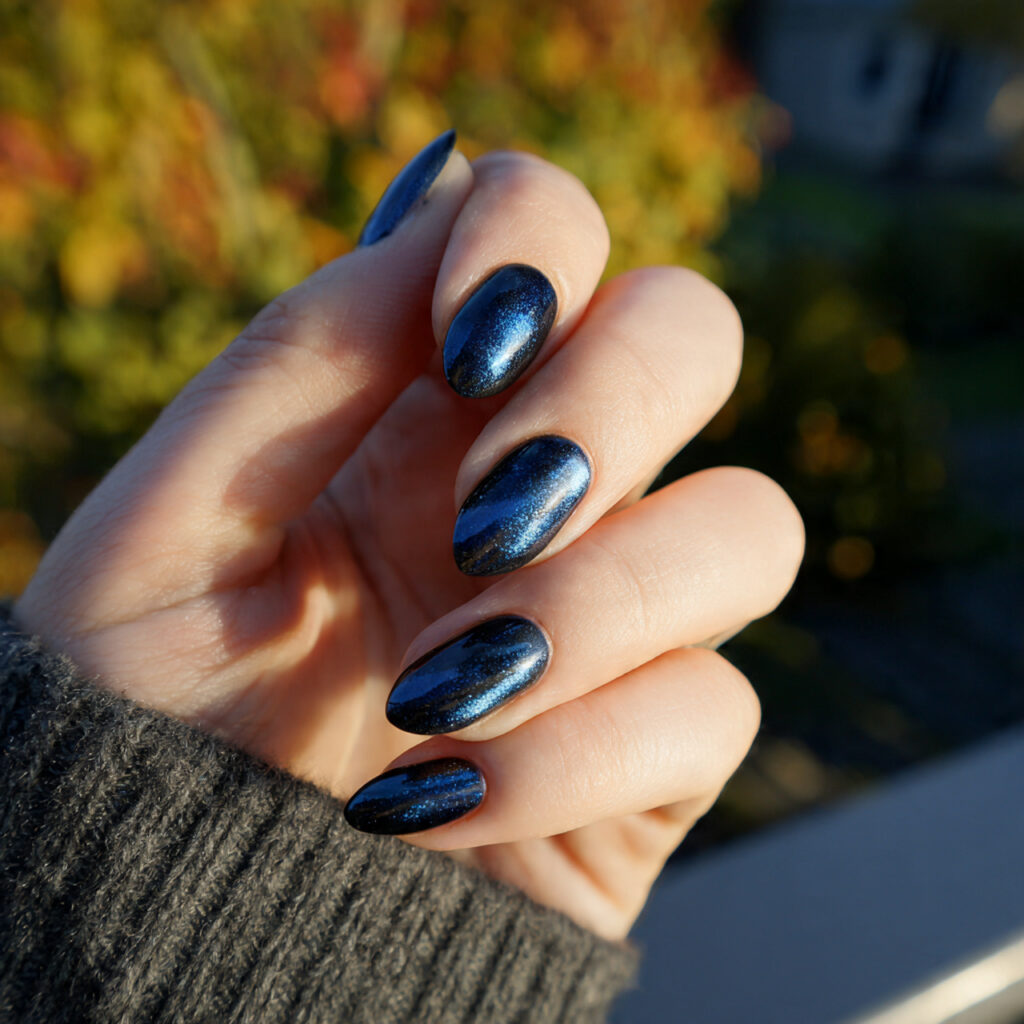attractive midnight blue cat eye nails with outdoo