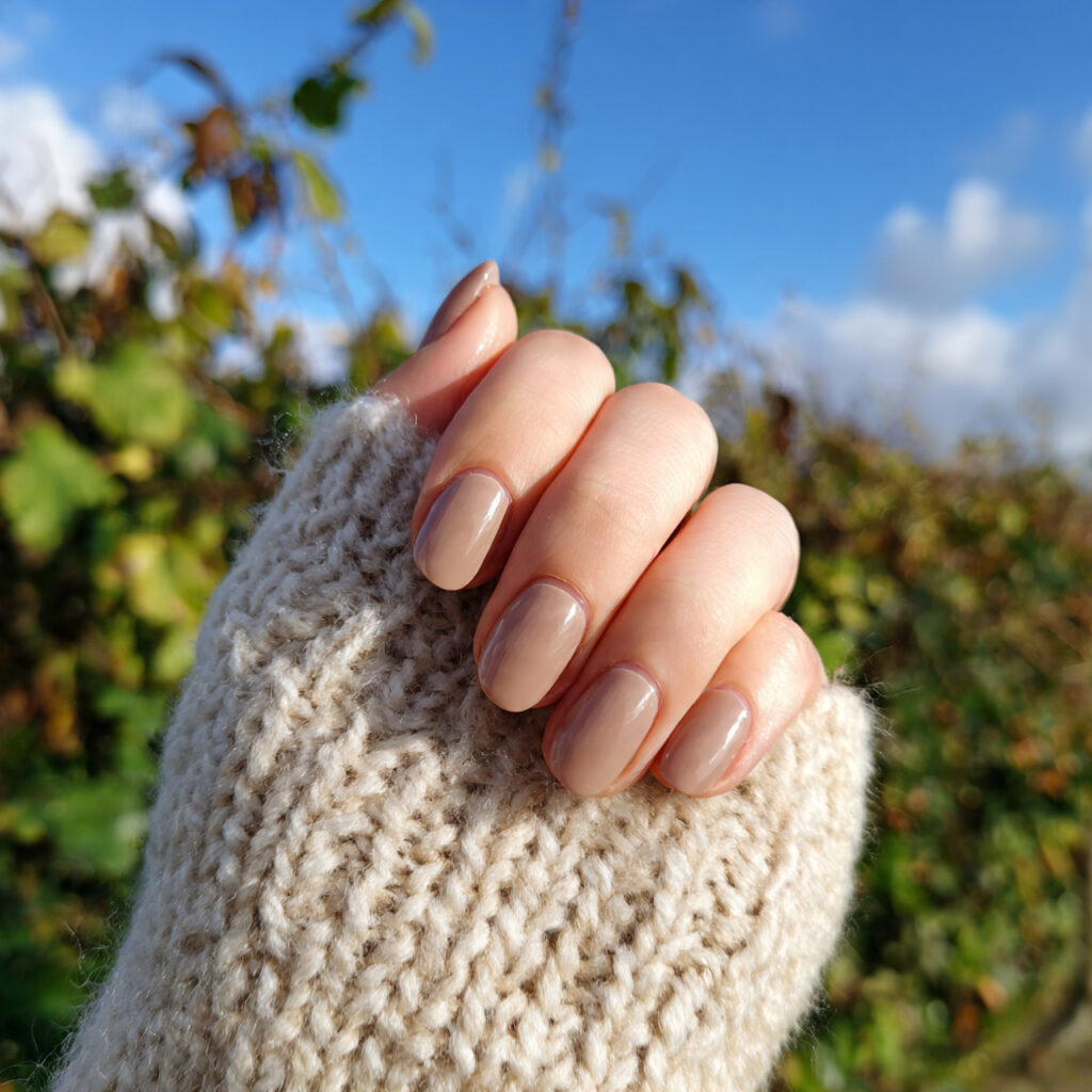 attractive milky latte brown nails with outdoor su