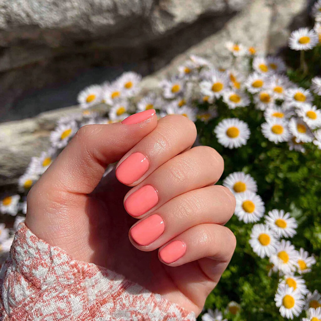 attractive milky peach short nails with outdoor su
