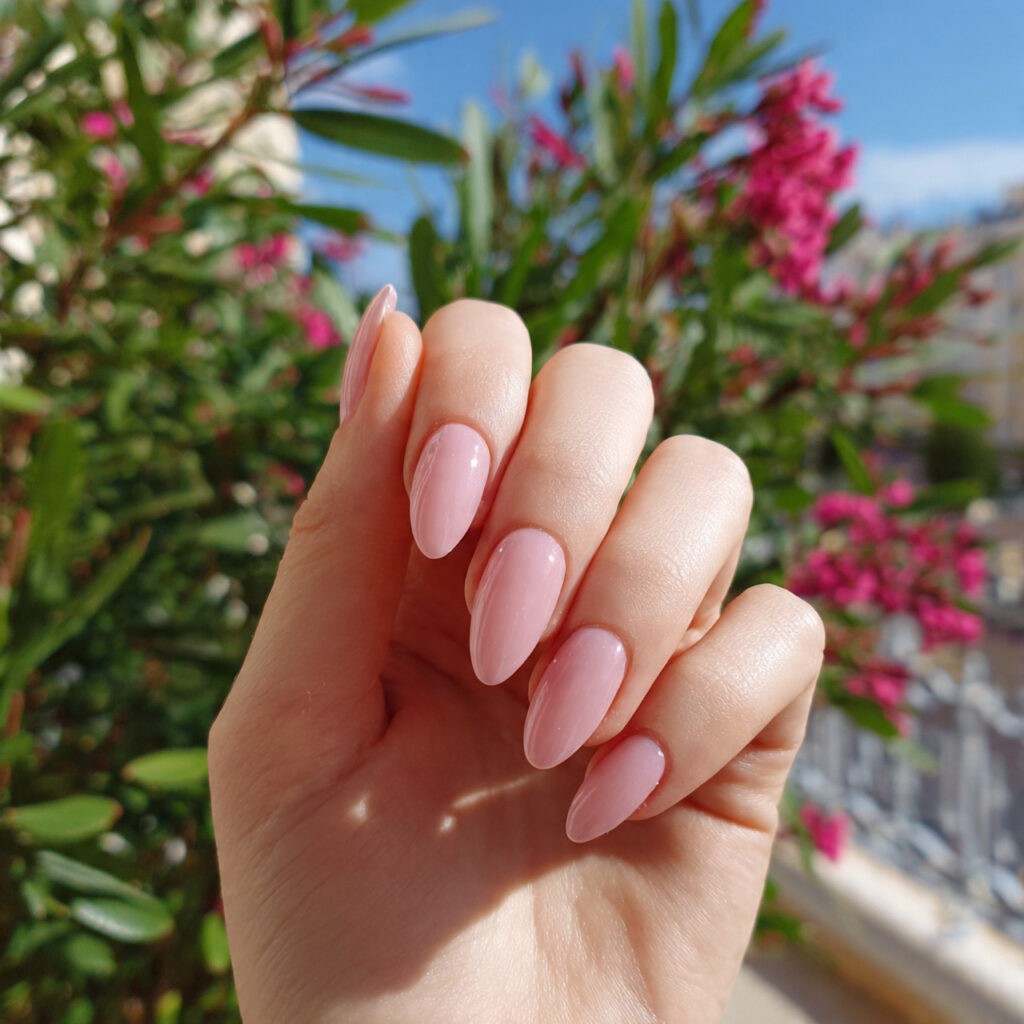 attractive milky soft pink nails with outdoor back