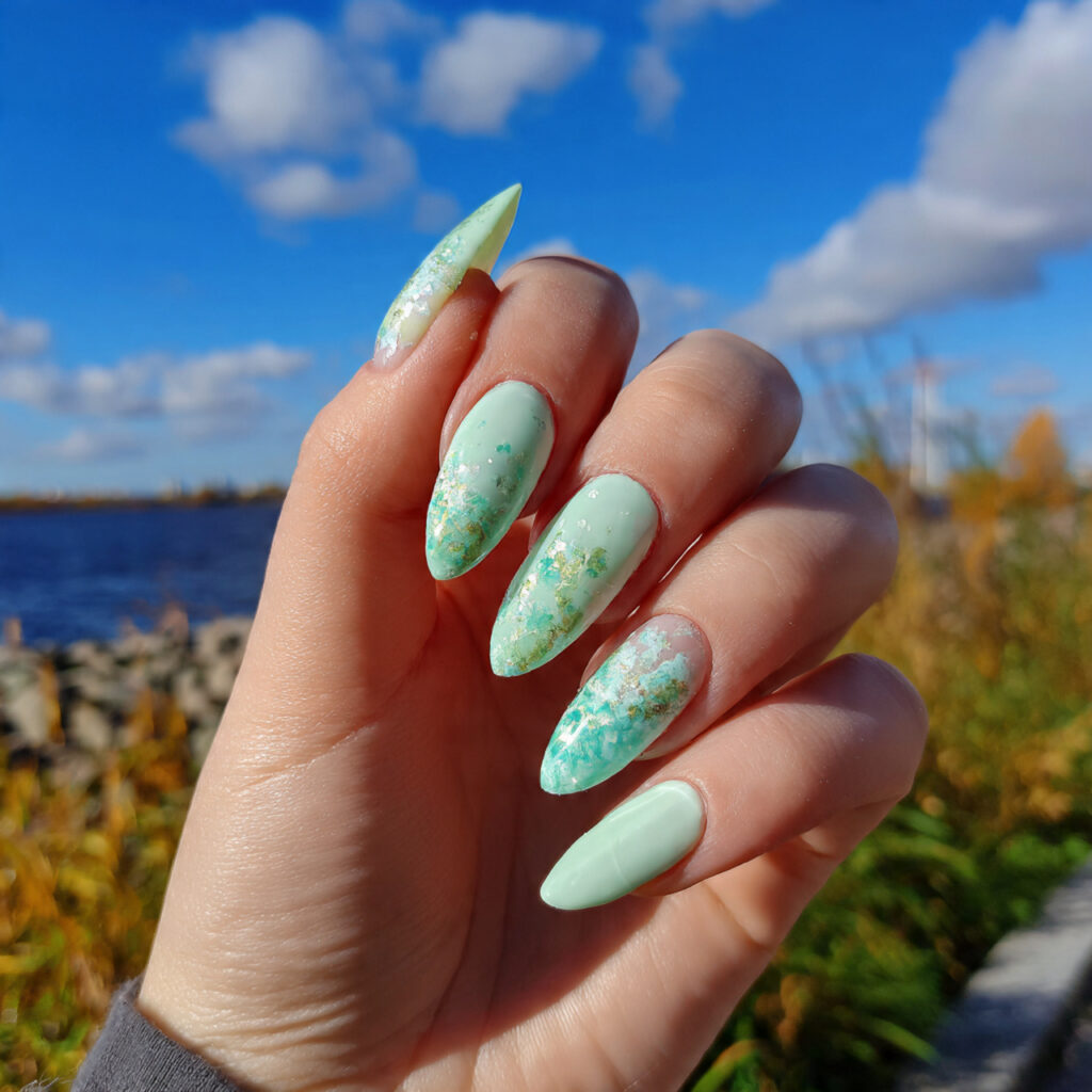 attractive mint matcha nails with a summer outdoor