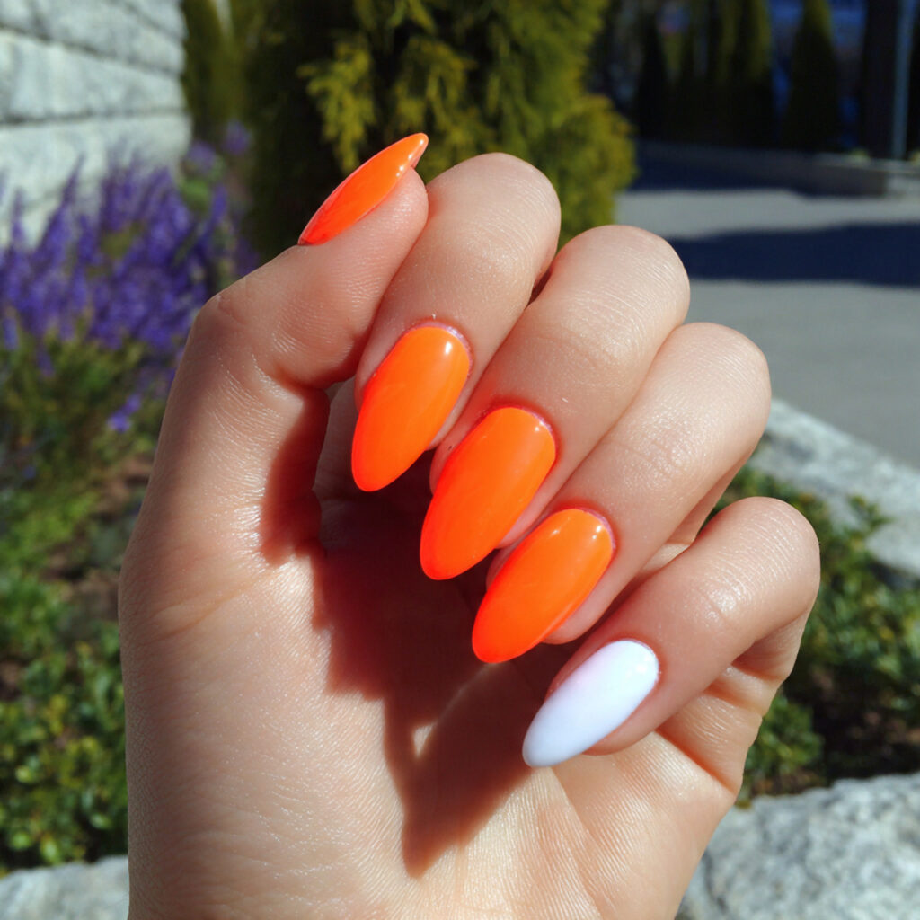 attractive neon orange pop with white accent nails