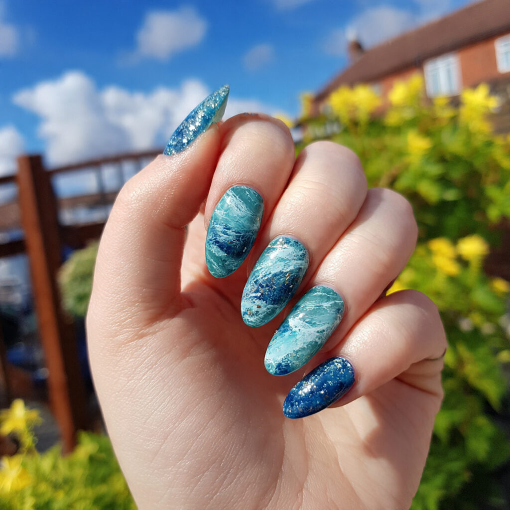 attractive ocean blue glazed nails with outdoor su