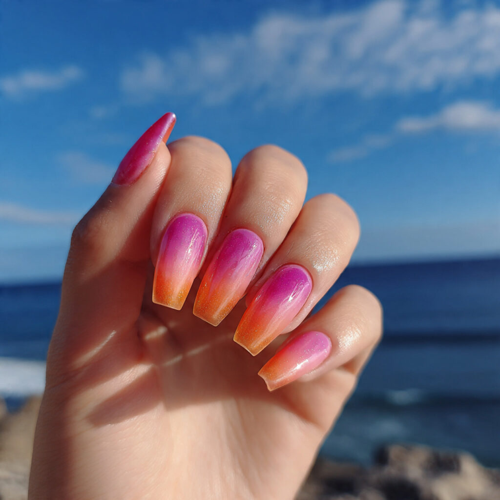attractive pink and orange aura nails with outdoor