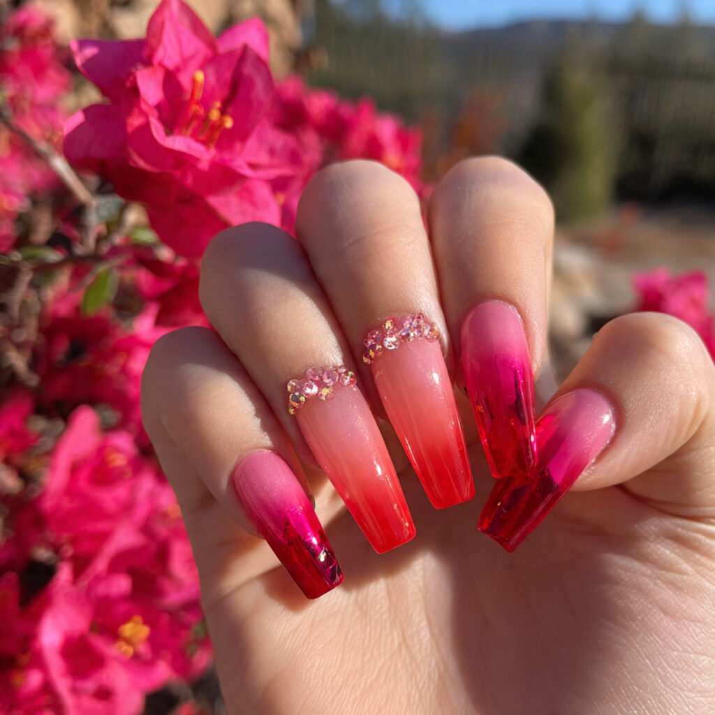 attractive pink and red aura nails with outdoor ba