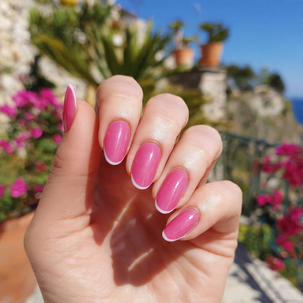 attractive pink micro french nails with outdoor ba