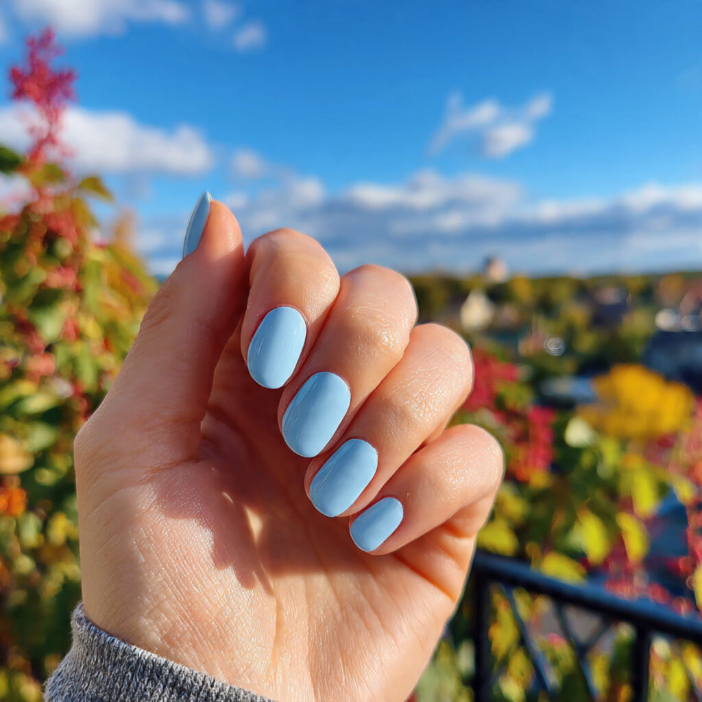 attractive powder blue short nails with outdoor ba