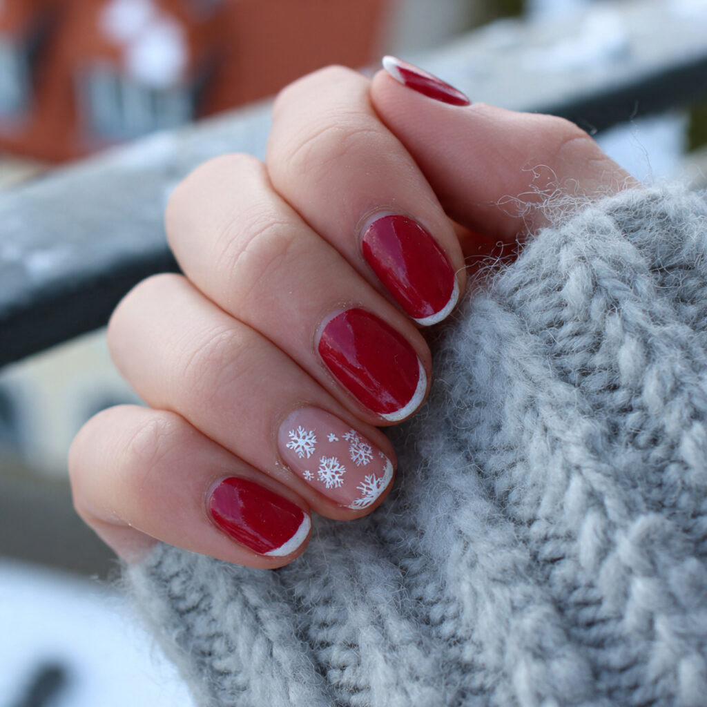 attractive red french tips with a tiny snowflakena