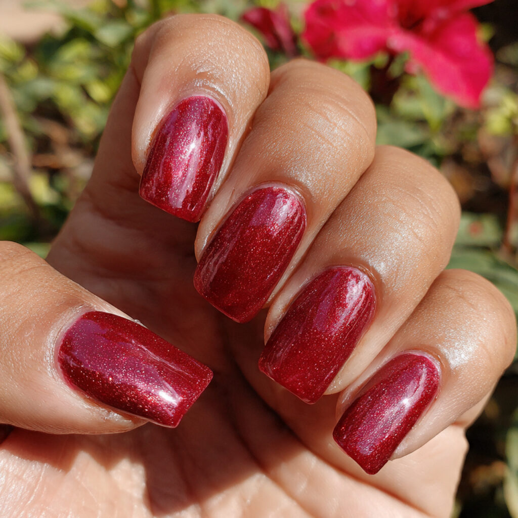attractive red jelly nails with subtle shimmer top