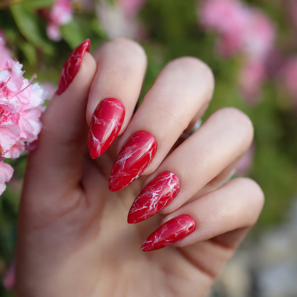 attractive red marble stiletto nails with summer o