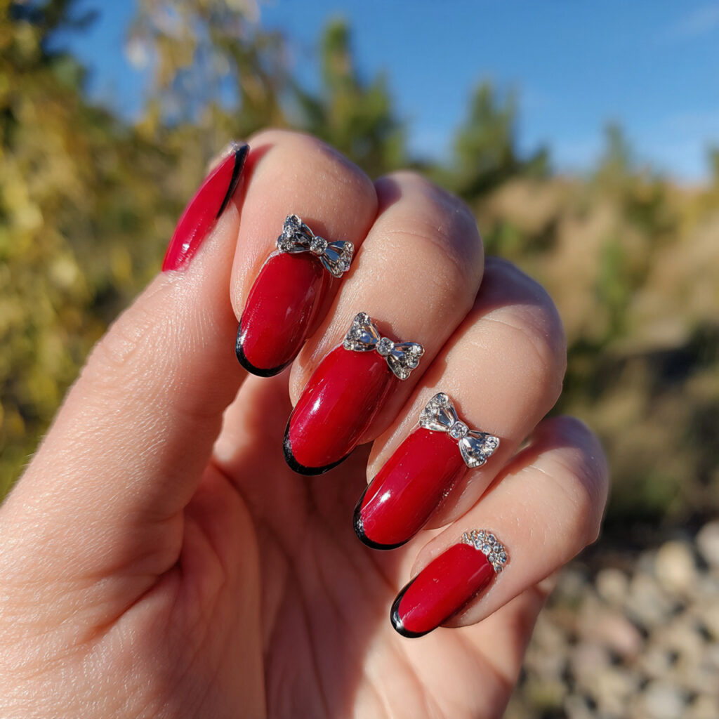 attractive red tips with tiny bow accent nails wit