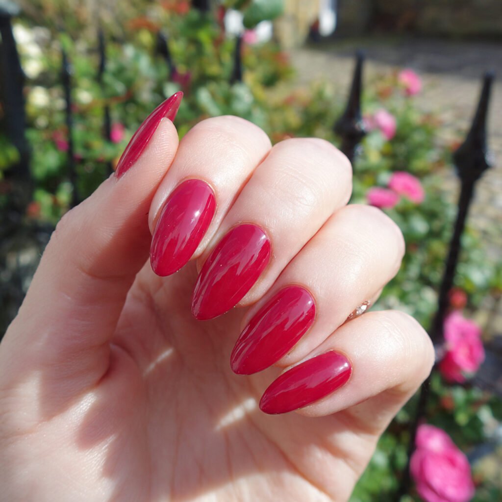 Nail Inspo Red: 14 Stunning Red Nail Ideas That Feel Bold, Chic, and Impossible to Ignore 13 attractive rose red gloss almond nails with outdoo