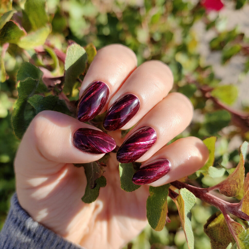 attractive ruby cat eye almond elegance nails with
