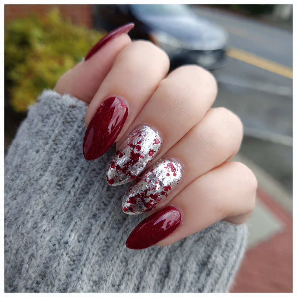 attractive ruby red almond with silver foil nails