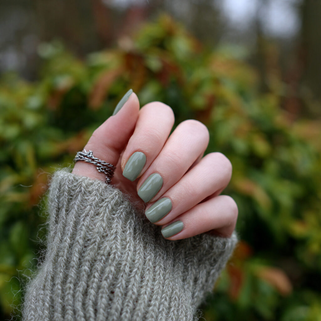 attractive sage green minimal nails with outdoor b