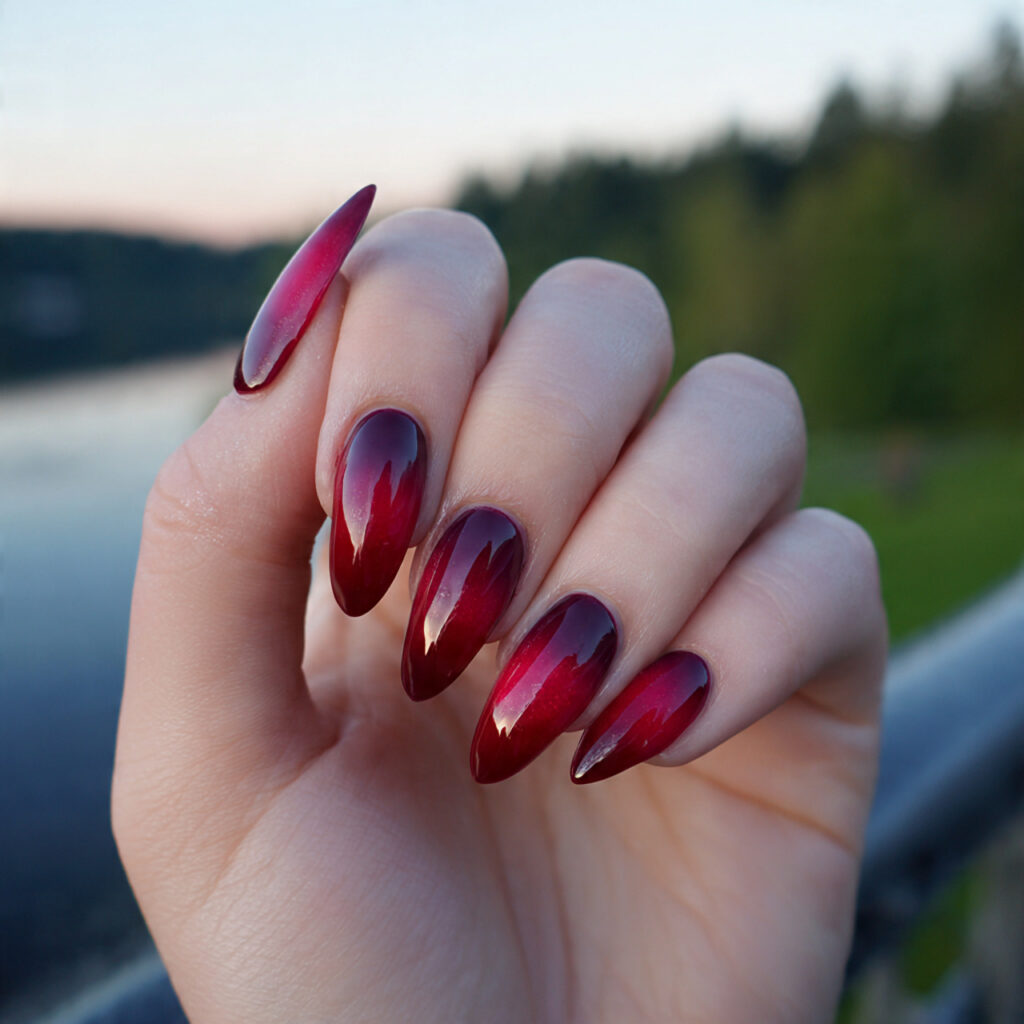 attractive scarlet to burgundy stiletto fade nails
