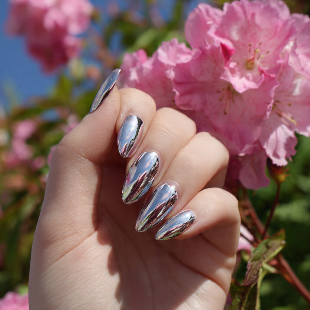 attractive silver chrome accent almond nails with