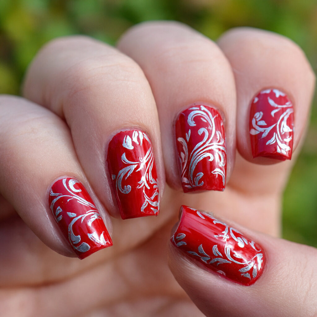 attractive silver swirls on red base nails with ou
