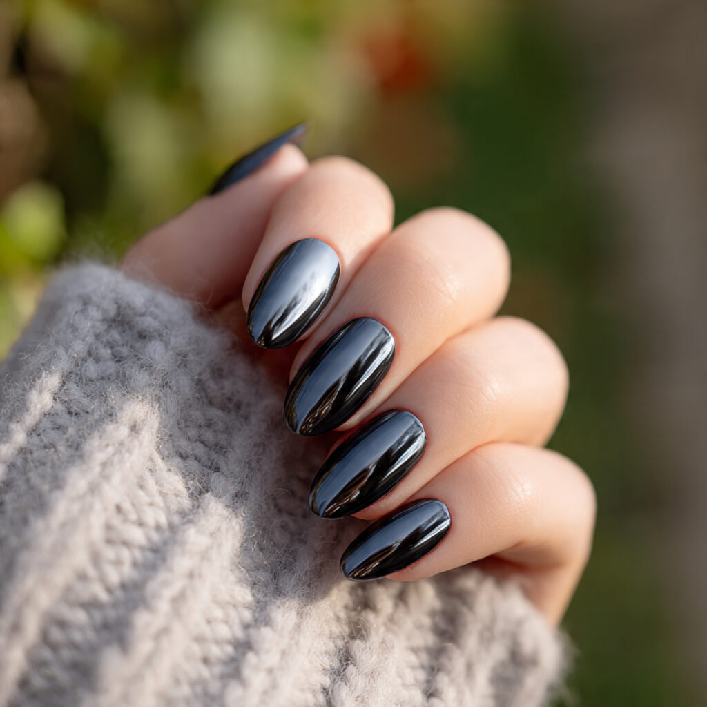 attractive soft black oval nails with a mirror fin