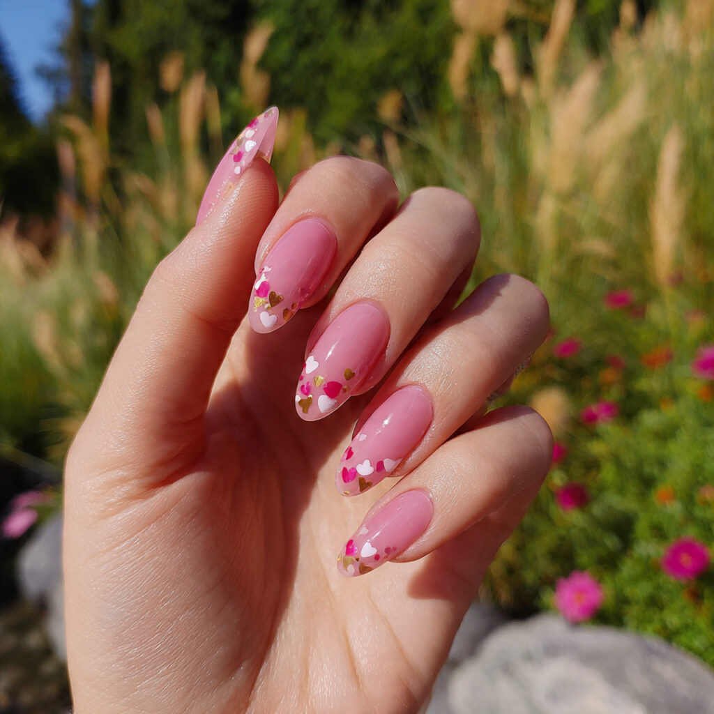 attractive tiny heart pink almond nails with outdo