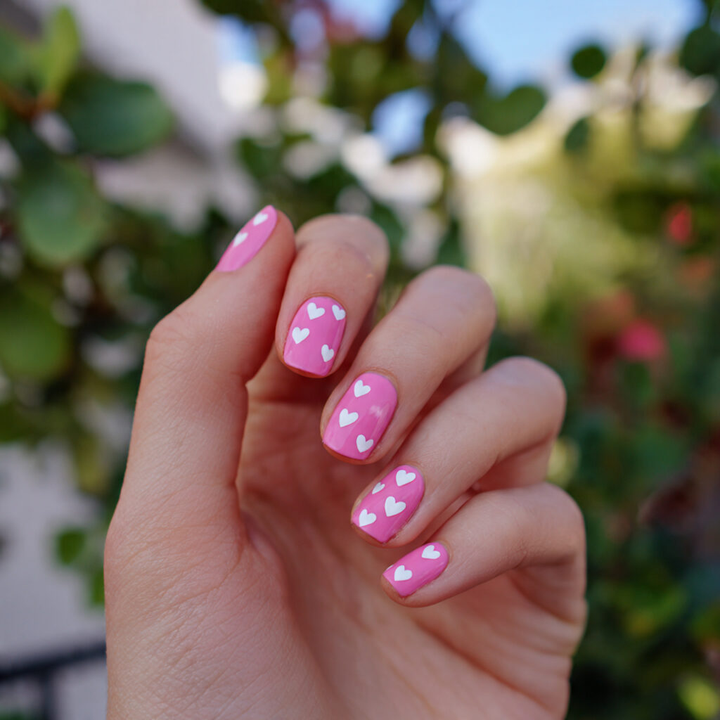 attractive tiny heart pink nails with outdoor summ