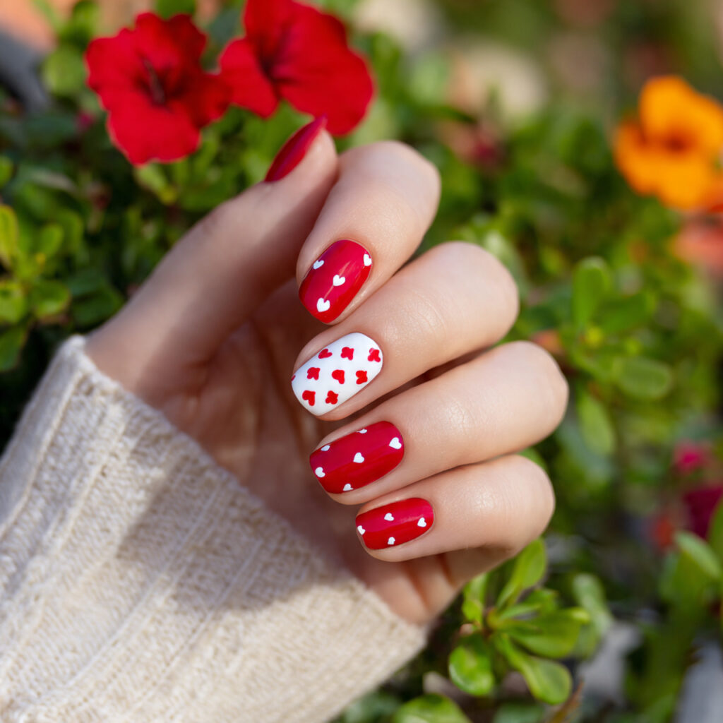 attractive tiny heart red accent nails with outdoo