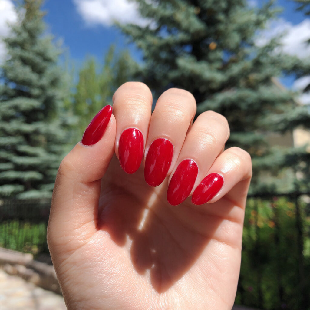 Red Nails Aesthetic: 14 Soft, Trendy & Pinterest-Perfect Ideas You’ll Want to Save 2 attractive true red short oval nails with outdoor