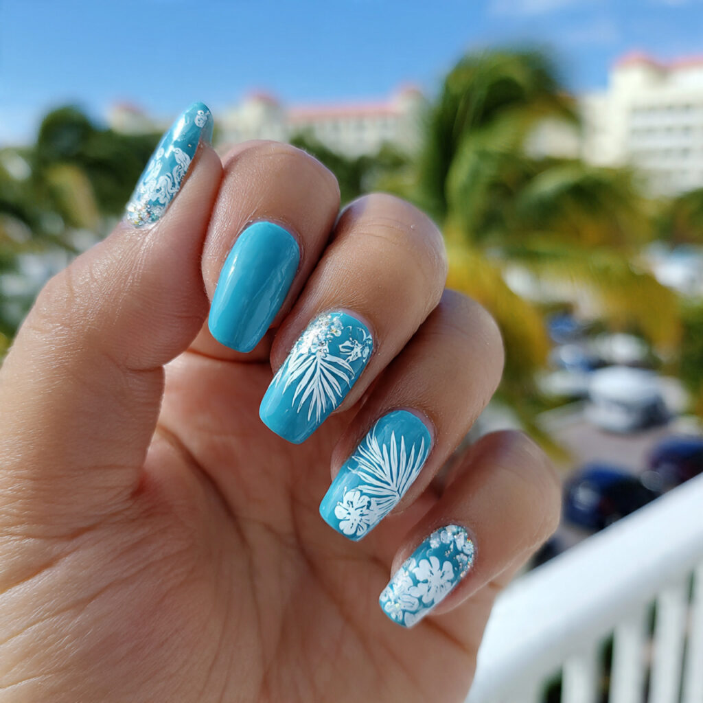 attractive turquoise and white floral accent nails