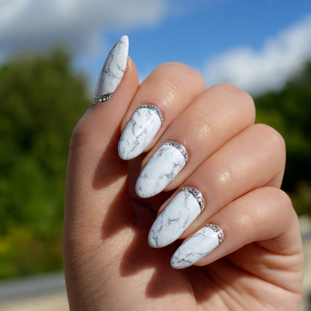 attractive white marble nails with silver detail w