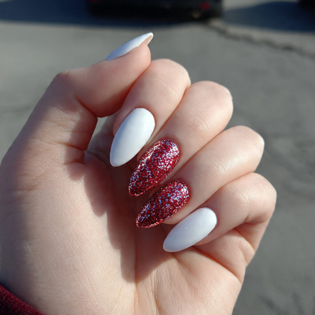 attractive white nails with red glitter accent nai