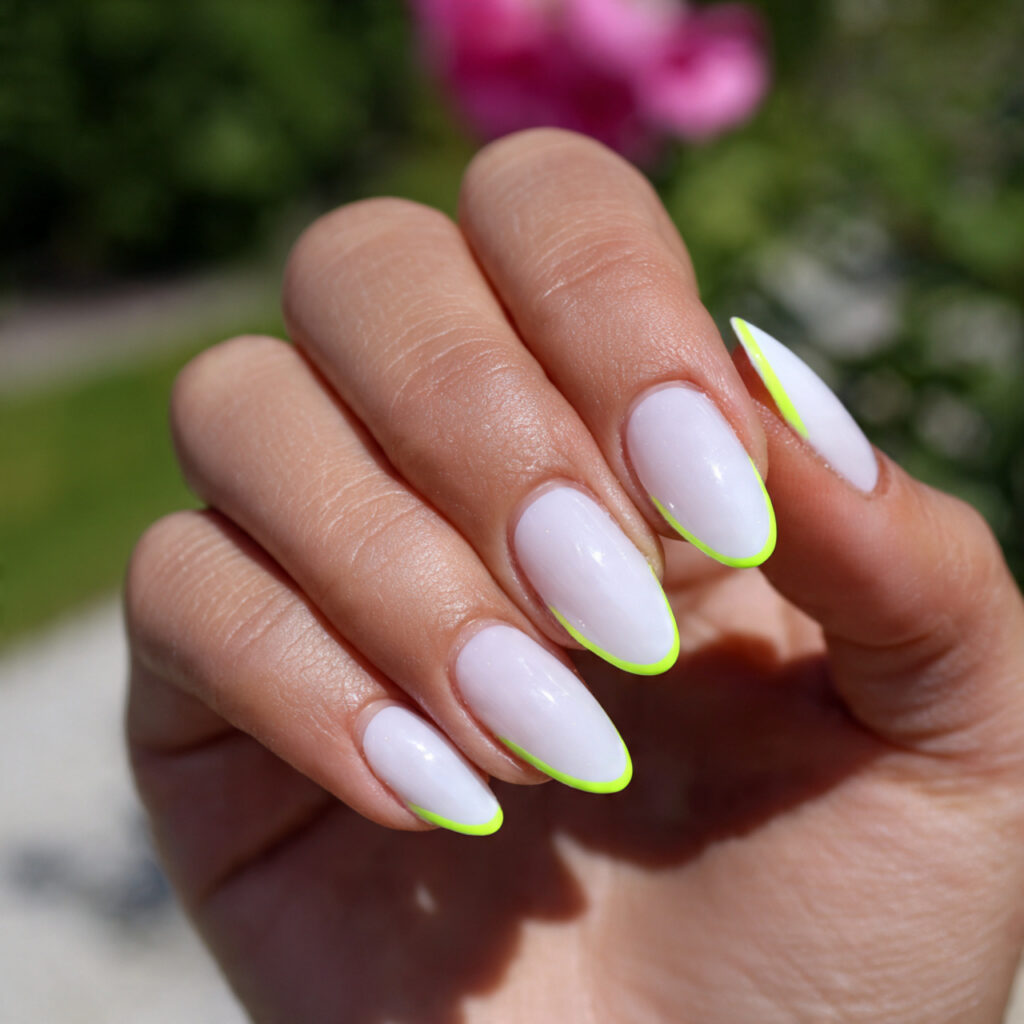 attractive white neon accent outline almonds nails
